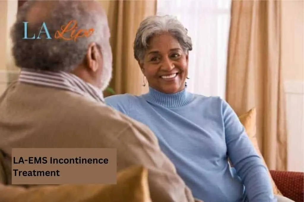 Couple sat smiling at each other - LA-EMS treatment Norfolk